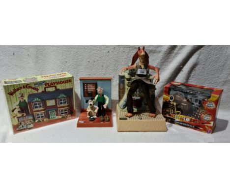 A Star Wars Jar Jar Binks moving animated model toy, a Doctor Who RC Dalek ( boxed ), a Wallace &amp; Gromit playhouse and a 