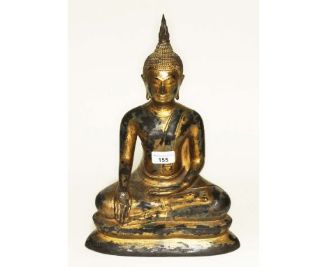 A Tibetan gilt bronze Buddha, height 36cm.Condition:- General wear through age, filled with 2" empty at the base, no sign of 