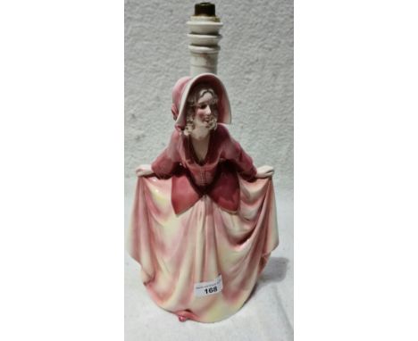 A Katzhutte mid 20th century ceramic lamp depicting a curtsy lady.  The lamp is not working, missing lead and electrical fitt
