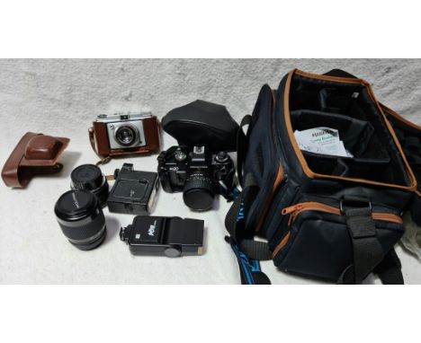 A Praktica Bx20 with lenses and flash in bag and a Iford sportsman vintage camera  