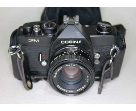 A Cosina CSM 35mm camera with leather case.  
