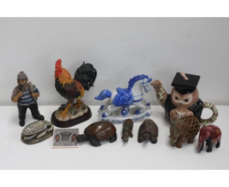 A quantity of china to include various ceramic egg cups, a number of animal figurines, a teapot in the form of an owl, A Leon