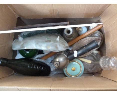 A mixed box of items including a green glass bottle, a decanter, flatware, two Truman beer and ale signs and a vintage iron