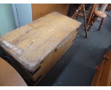 A vintage pine trunk, with metal strapwork, (yellow)