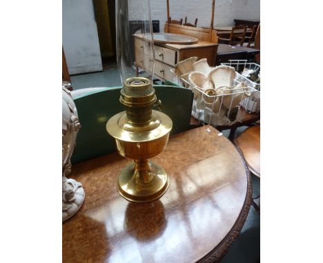 A brass oil lamp with on turned base