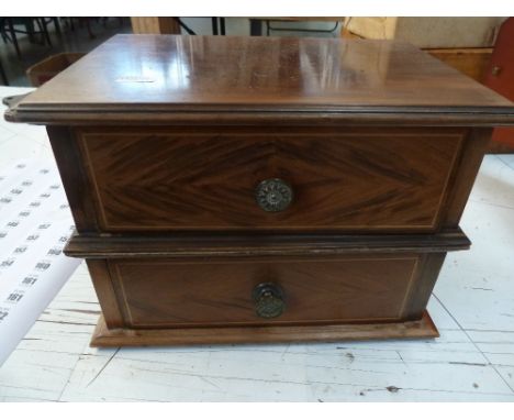 A 20th century two drawer miniature chest, top drawer with internal shelf, turned brass handles, 28cmW x 19cmD x 20cmH