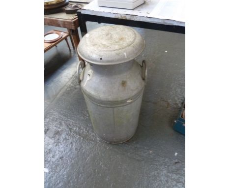 A vintage aluminium milk churn, with a set of bellows