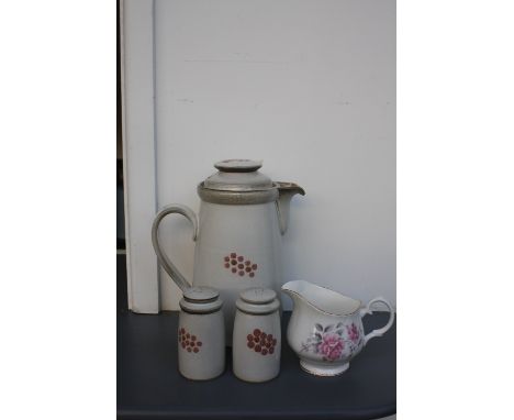A quantity of Denby Pottery of pink hand painted floral design to include a teapot, cups, saucers, egg cups, salt and pepper 