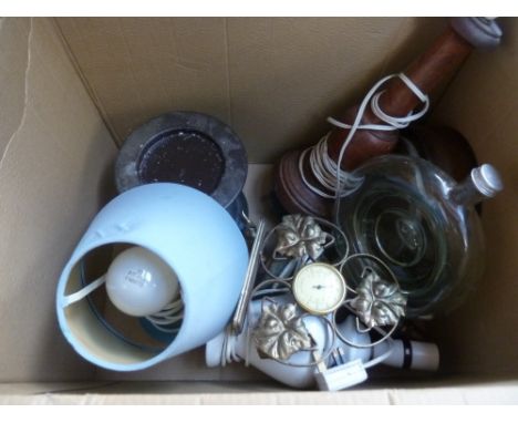 A mixed box to include a wooden lamp base, a blue ceramic bedside lamp, a round glass bottle, a thermometer, a 'Smith's' Mant