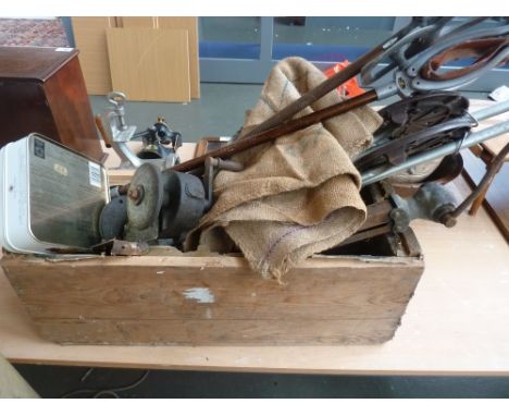 Wooden box of four shooting sticks, knife sharpener, two vintage hessian sacks, three wood saws and tin box of tobacco pipes
