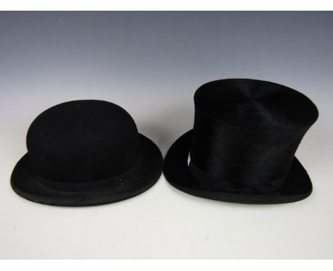 A vintage top hat together with a bowler hat