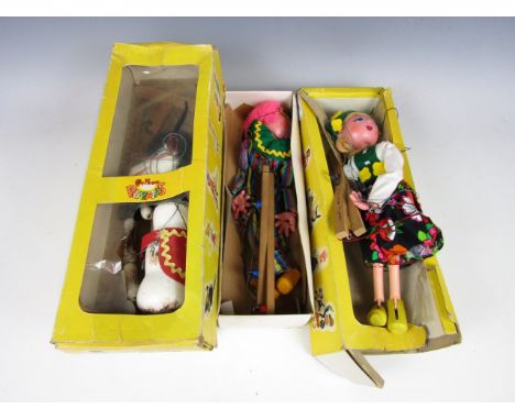 Three vintage boxed Pelham puppets including a horse and a clown (boxes a/f)