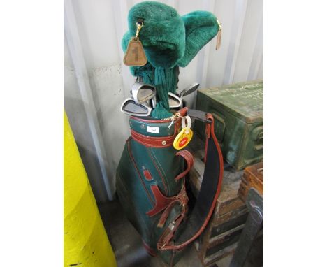 A set of mostly Howson golf clubs with bag