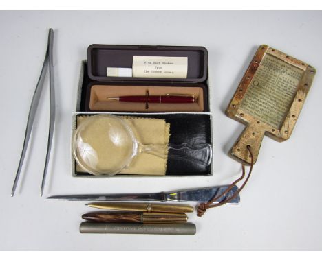 Sundry collectors' items including a Parker pencil, a letter opener, a magnifying lens and a novelty Lord's Prayer in the for