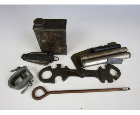 A Second World War British Army clasp knife, machine gun oil can, pistol cleaning rod, First World War button stick, US milit