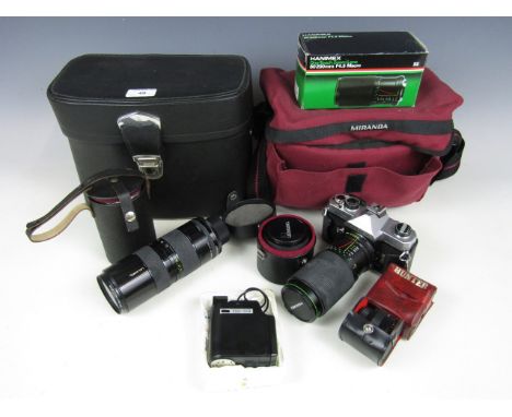 A quantity of camera equipment including a Tameron camera lens, a Yashica ES20 flash, a Carl Zeiss Sonar 3.5 / 135 lens, a Fu