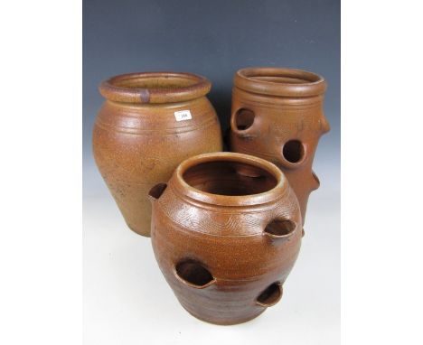 Two strawberry planters and one other planter