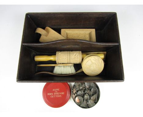 Sundry kitchenalia including a cutlery box, wooden moulds and stamps together with a vintage tin containing Aspic and Hors D'