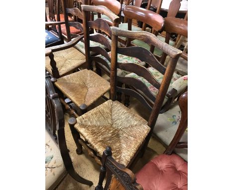 A pair of late 18th / early 19th century rush seated ladder-back chairs