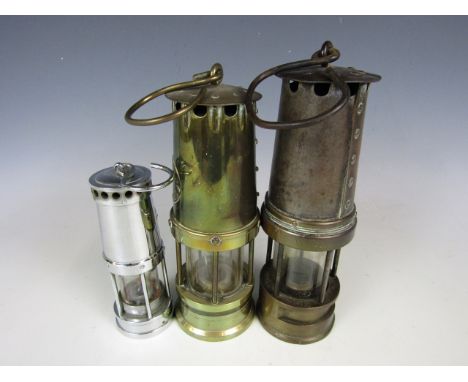 Three vintage miners' lamps 