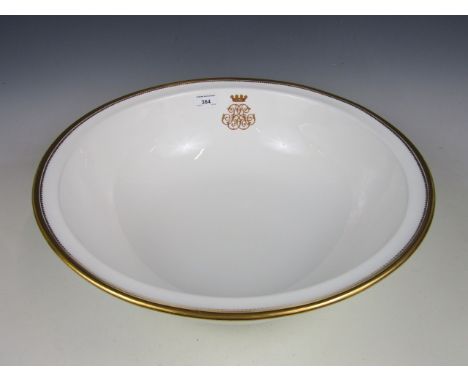 A 19th Century Copeland porcelain wash basin with gilded decoration and monogram with coronet 