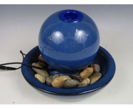 A ceramic orb water feature