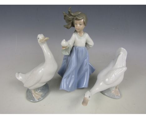 Three boxed Nao figurines, Girl with Bird No. 01088, Duck No. 00244 and Duck No. 00245