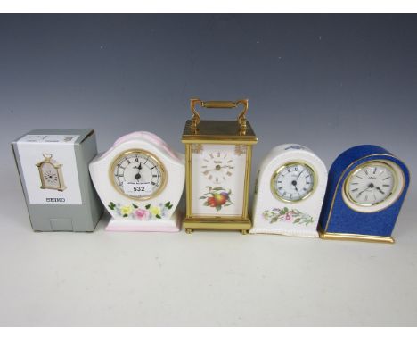 A Spode carriage clock together with three Aynsley clocks and one other