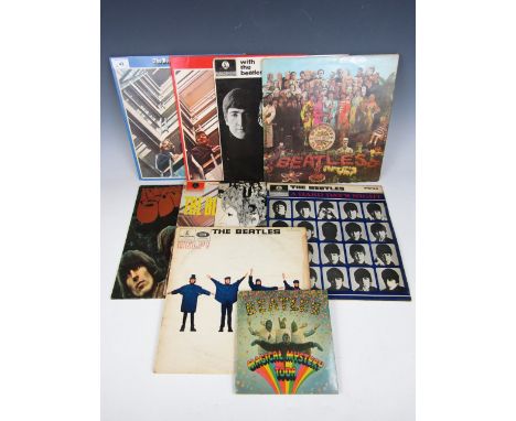 A collection of vintage The Beatles Parlophone records / LP's, including Help! PMC 1255, A Hard Day's Night PCS 3058, Revolve