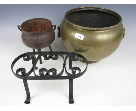 A brass planter together with a small cauldron and trivet