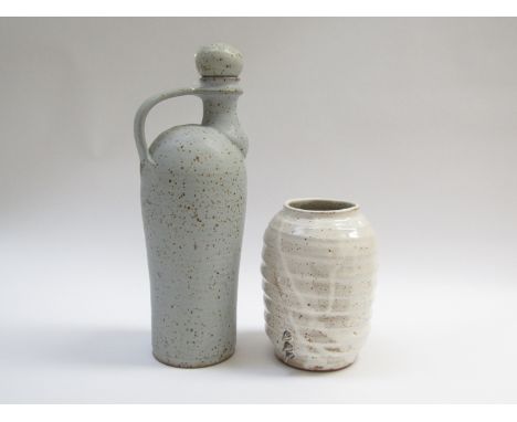 A studio pottery stoneware flask with handle and stopper with ash glaze and iron oxide spotting, 32cm high and another stonew