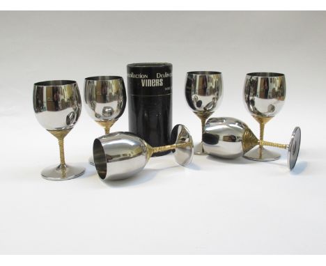 A set of six Stuart Devlin designed stainless steel wine goblets for Viners. Original box for one goblet 