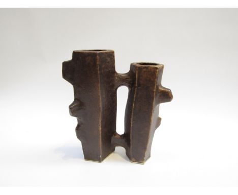 A studio ceramic 'Brutalist' vases joined as one, dark treacle glaze. Unmarked 23cm high. 