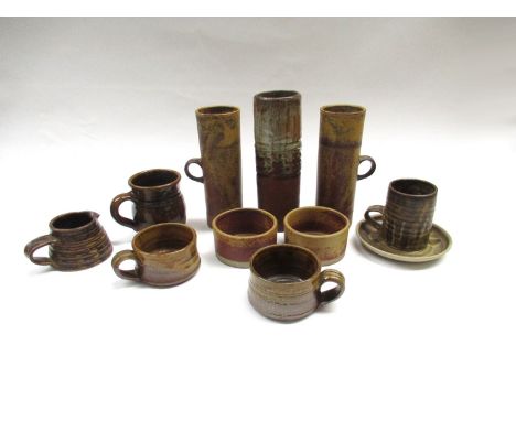 A collection of studio pottery to include Robin Welch tankards (chip to handle of one), two similar pots, Bob Dawe vase, mugs