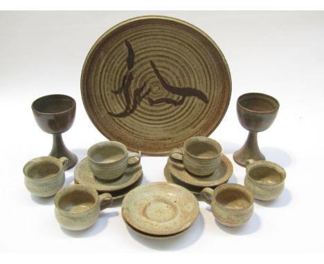 A set of six Biddy Rose pottery teas cups and saucers together with six similar goblets and a charger by Graham Piggott of 32