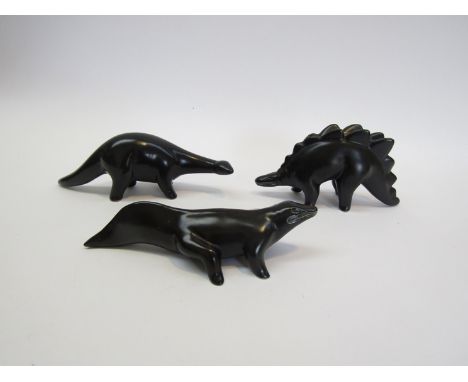 Three vintage matt black pottery dinosaur figurines, similar in style for the range desinged by Colin Melbourne for the Midwi