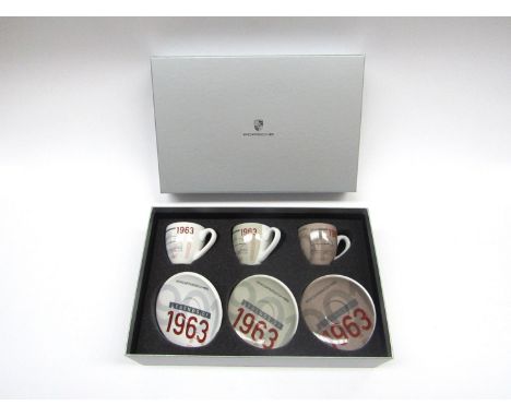 A boxed set of limited addition Porche 1963 motor racing espresso cups and saucers, individually numbered to base. 