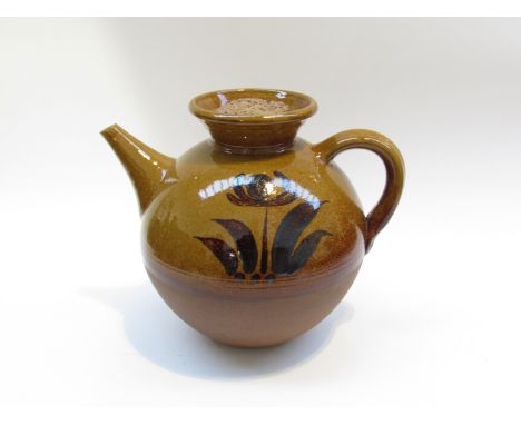 PETER DICK (1936-2012) A Coxwold Pottery teapot of large proportions. Treacle glaze with painted floral detail. Unmarked. 24c