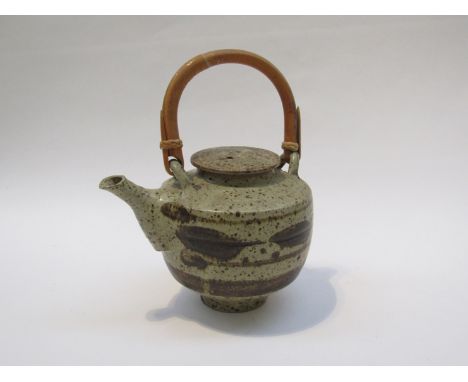 HUGH WEST (b.1950): A Studio Pottery lidded teapot, brush work detail. Cane handle. 14cm high to lid 