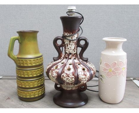 A West German Pottery floor lamp in brown and white glazes, 56cm high, together with two floor vases, 429-45 and Scheurich 23