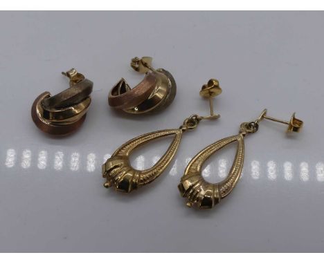 A pair of modern 9ct gold hollow ear pendants; together with a pair of modern 9ct three-colour gold ear studs, gross weight 5