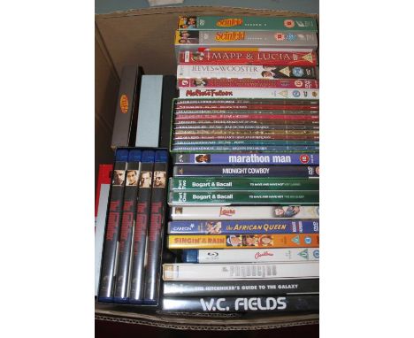 Two boxes of miscellaneous DVD's and CD's to include Seinfeld - The Complete Series box-set with book, Laurel &amp; Hardy - T