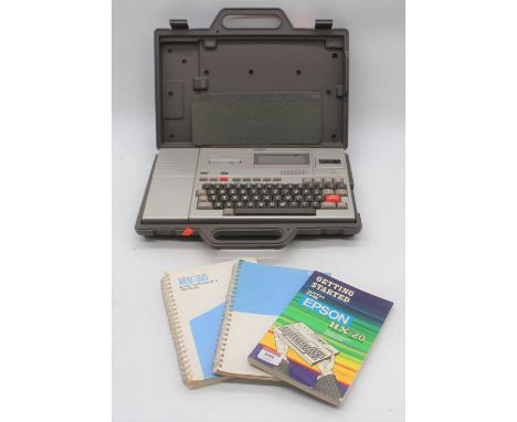 An Epson HX-20 portable computer, with operation manual