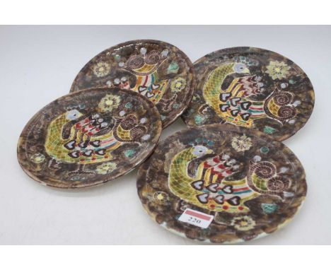 A set of four Guy Trevour Quimper plates, each decorated with a bird, dia.19cmOne plate has a chip repair as per image.
