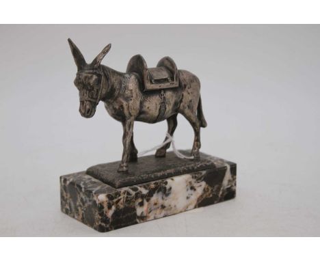 A continental paperweight, white metal model of a donkey, mounted upon a polished marble hardstone plinth, h.10.5cmNo apparen