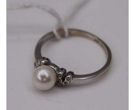 A contemporary white metal, cultured pearl and diamond point set dress ring, 2.4g, size L/M