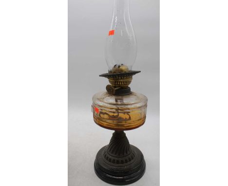 A Victorian oil lamp, having amber glass font, h.54cm 