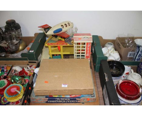 A collection of vintage toys and games to include The Super Compendium of Games and a Fisher Price model parking carriage, an