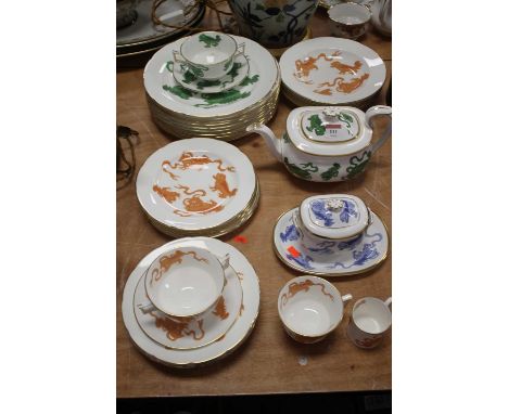 A Wedgwood Chinese Tigers pattern part tea and dinner service, in red, green and blue variations