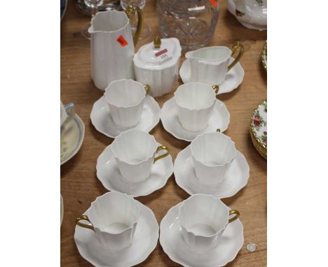 A Wedgwood porcelain gilt decorated part coffee service 